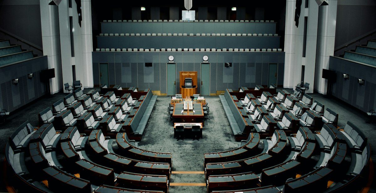 An empty legislative chamber, seen from the gallery